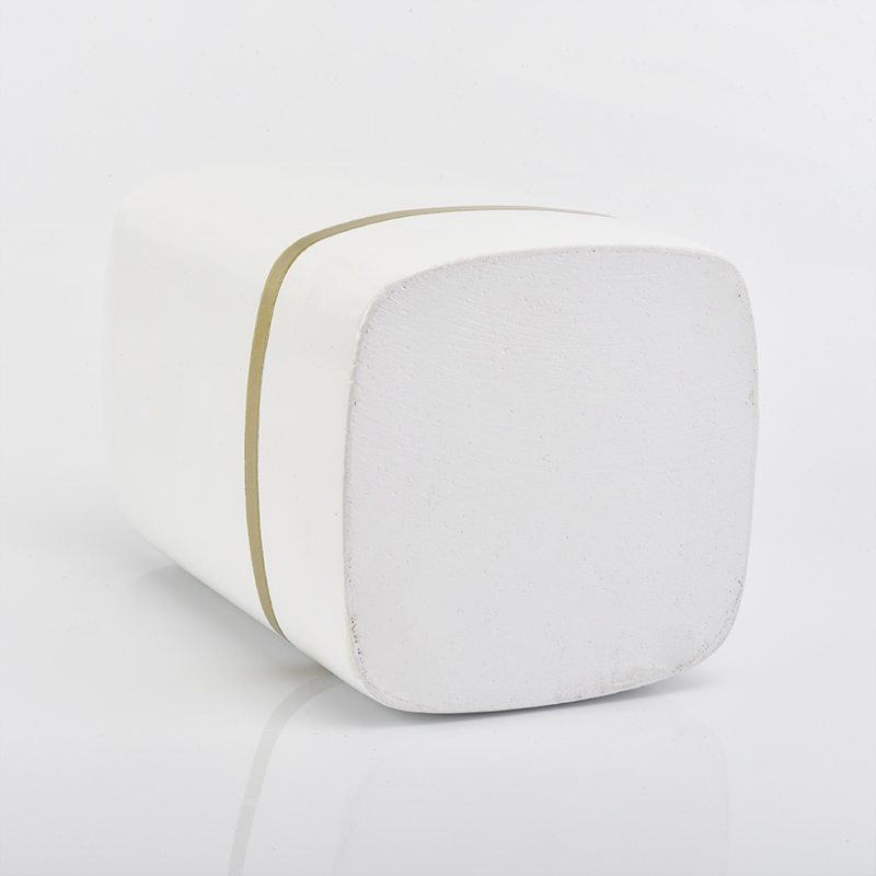 white rectangle concrete candle jars