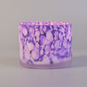 Glass candle holder frosted outside with iridescent color pattern