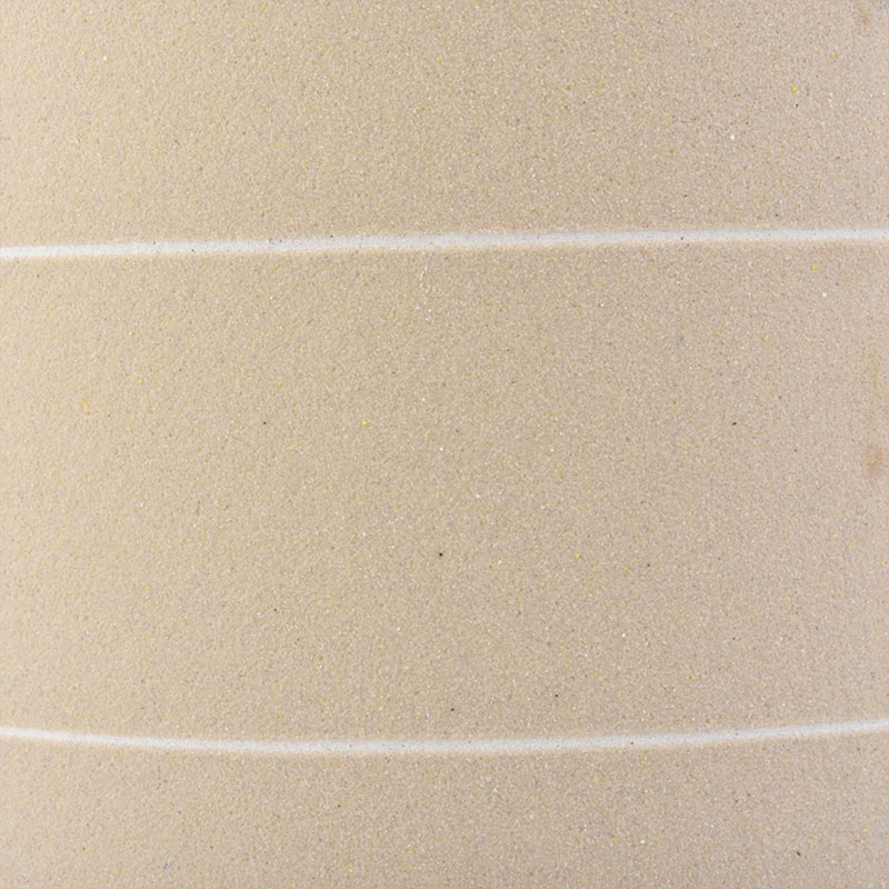 curved bottom matte yellow ceramic candle jar with white lines
