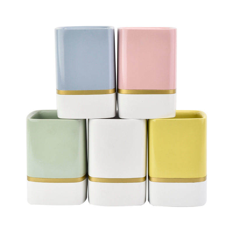 white rectangle concrete candle jars