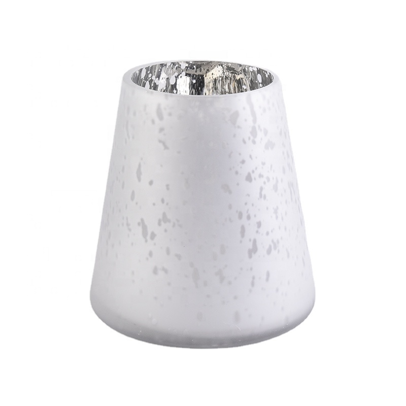 Large white glass candle vessels with mercury decorations