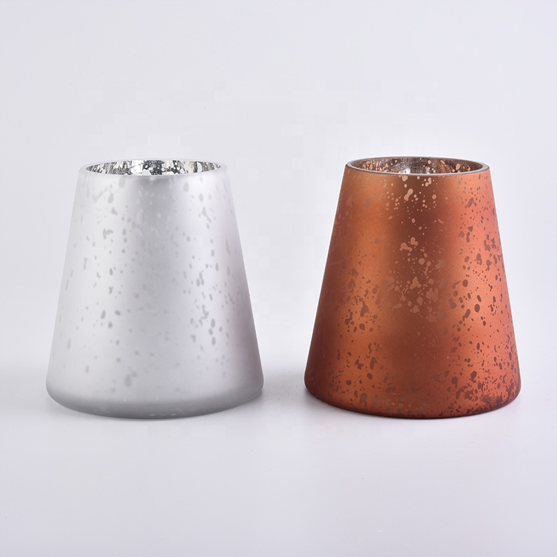 Large white glass candle vessels with mercury decorations
