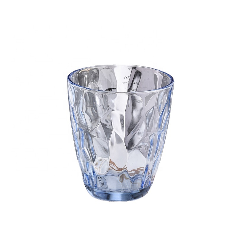 transparent blue glass candle holders with knock patterns