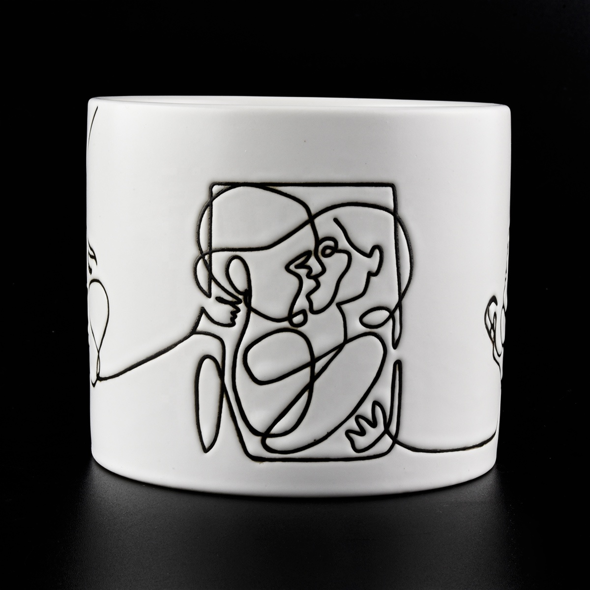 white ceramic candle jars with black printing