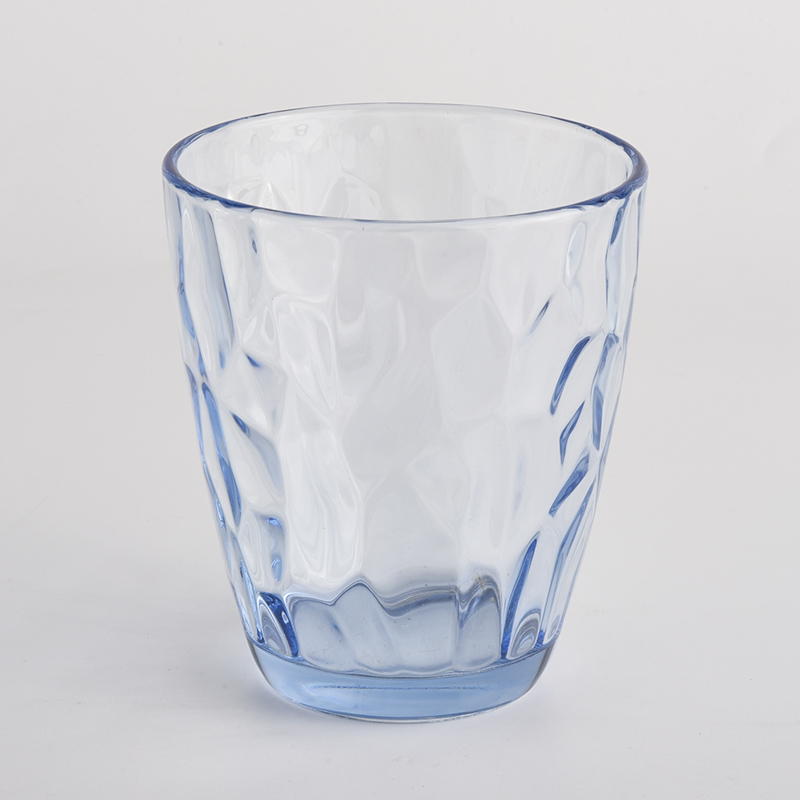transparent blue glass candle holders with knock patterns