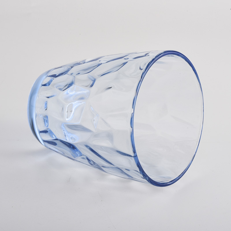 transparent blue glass candle holders with knock patterns