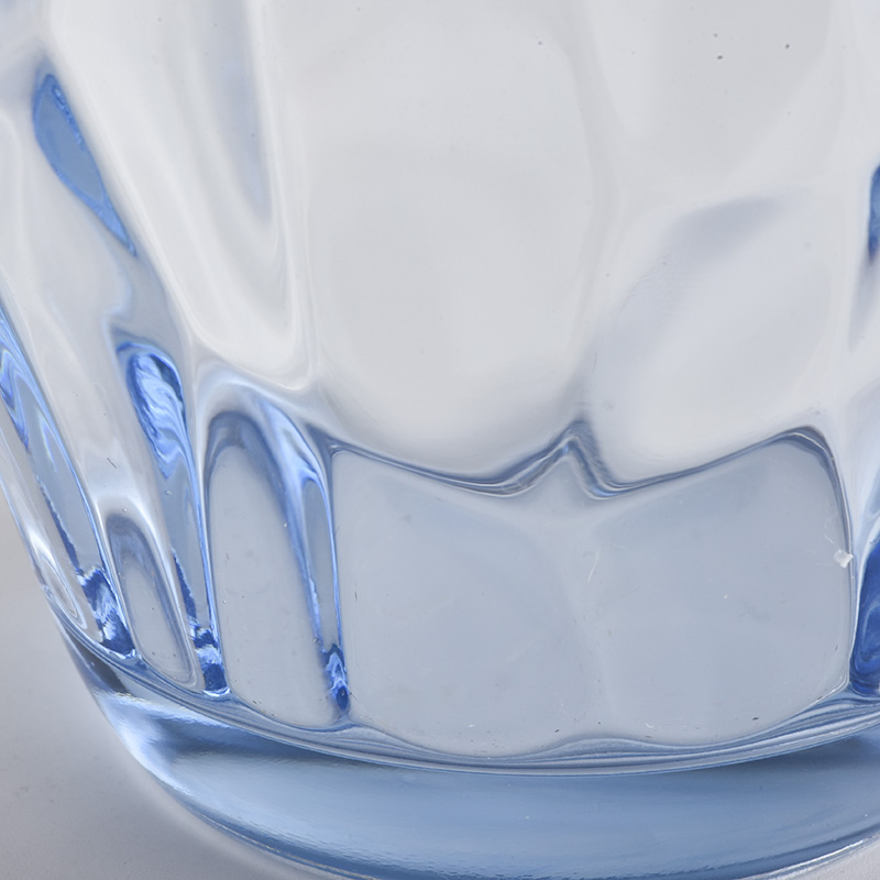 transparent blue glass candle holders with knock patterns