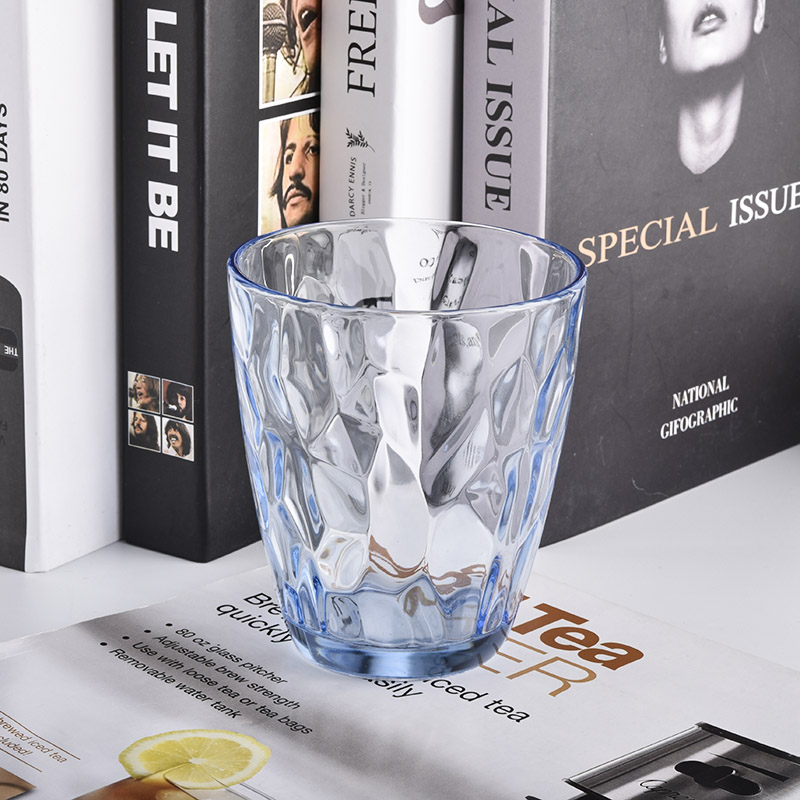 transparent blue glass candle holders with knock patterns
