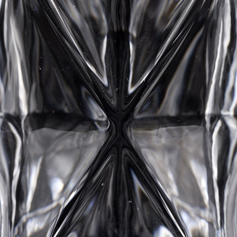 high white glass candle jars with cut geo designs