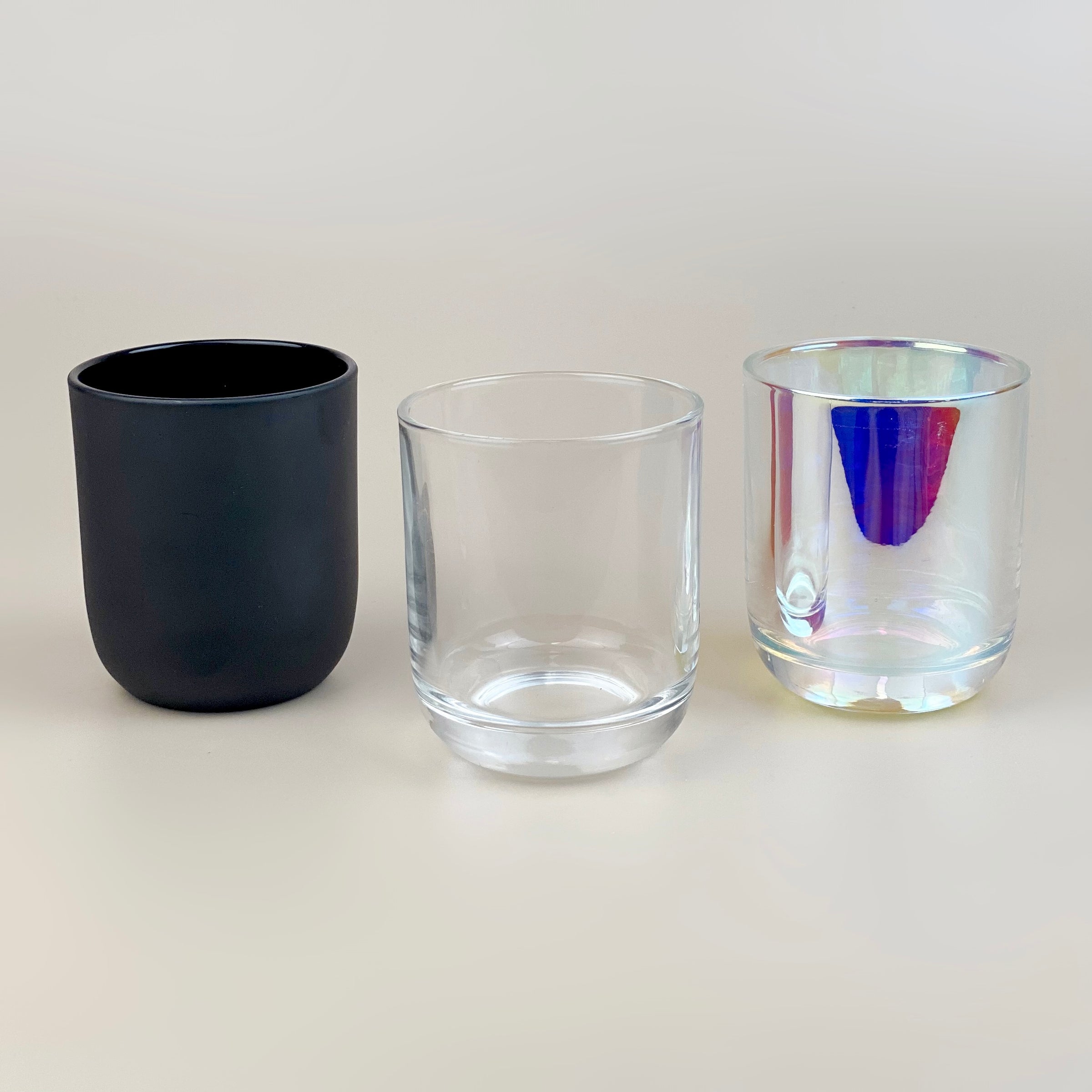 Round bottom glass candle jars and containers with wax