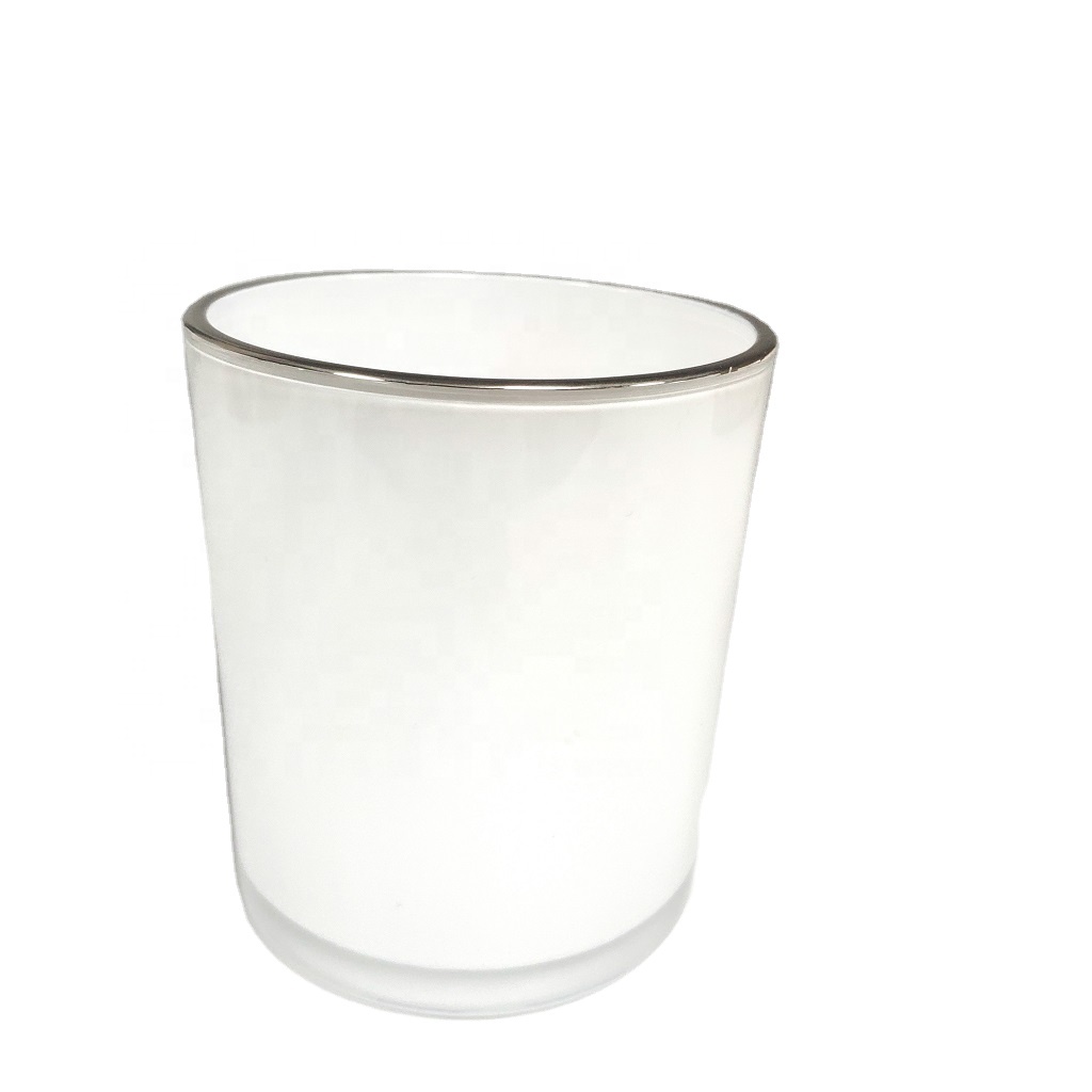 spraying white color glass candle jar with gold rim