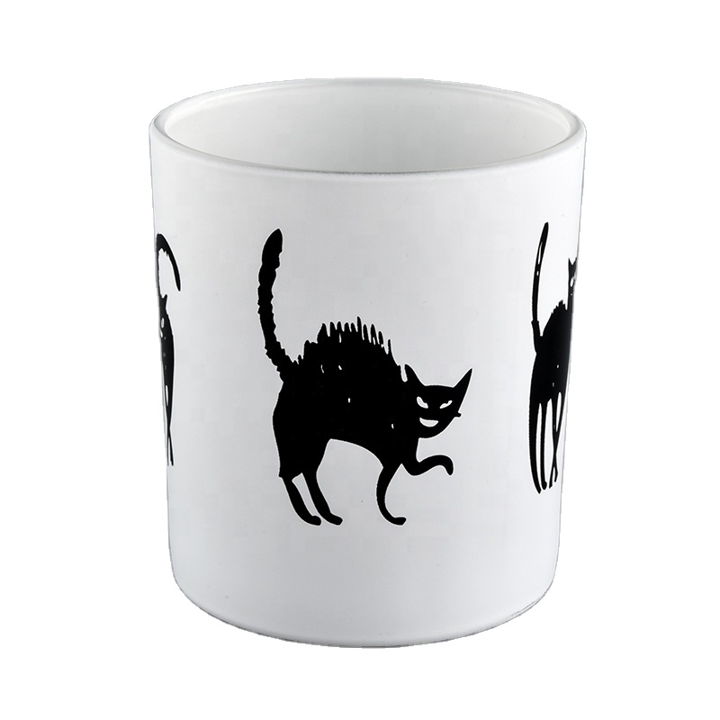 White glass candle jars with black printing