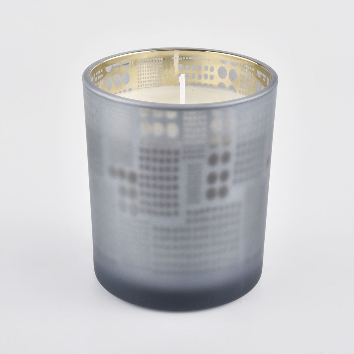 spraying color glass candle containers with gold color