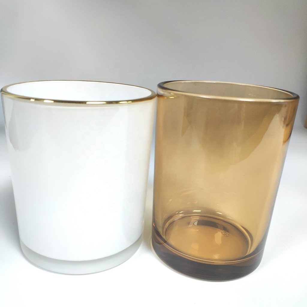 spraying white color glass candle jar with gold rim