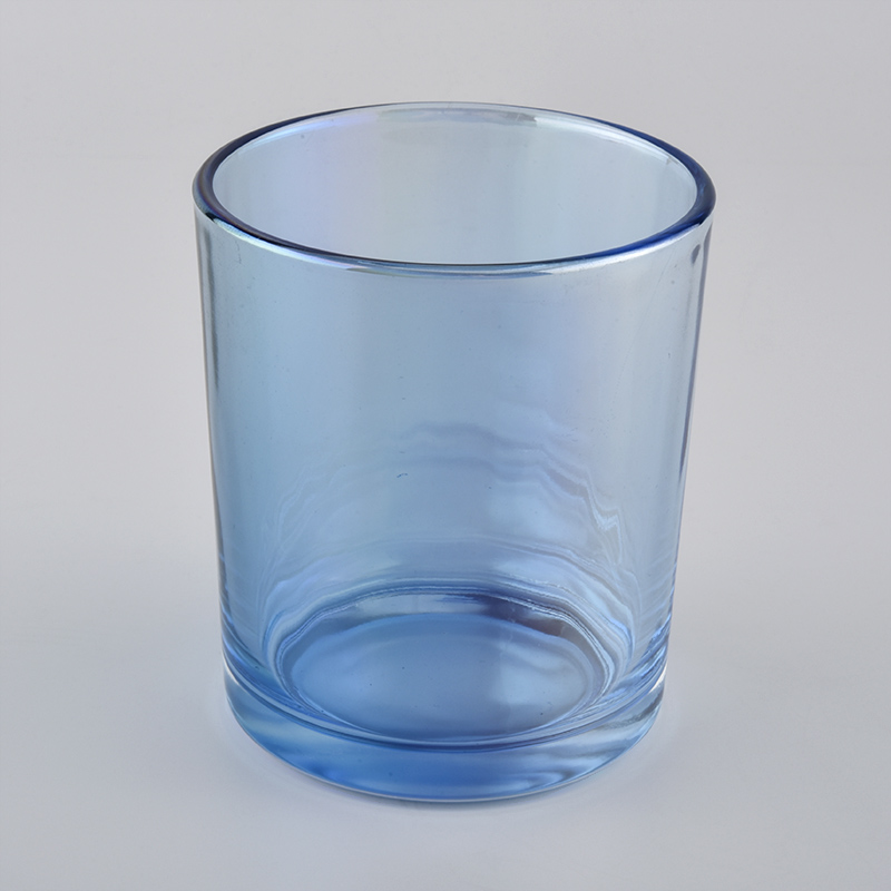 spraying color glass candle jar for Christmas holiday