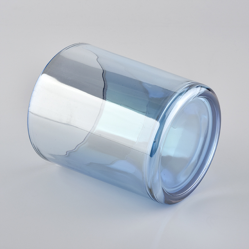 spraying color glass candle jar for Christmas holiday