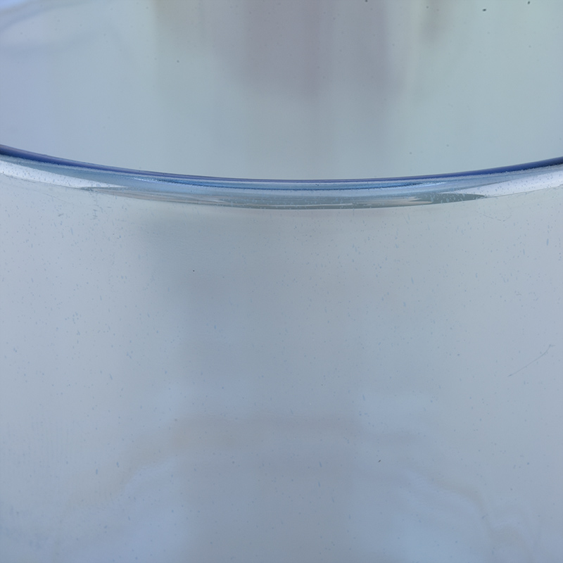 spraying color glass candle jar for Christmas holiday