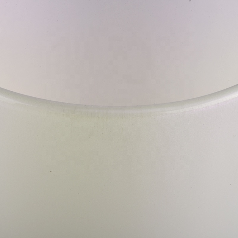 white iridescent candle holder with spraying color inside