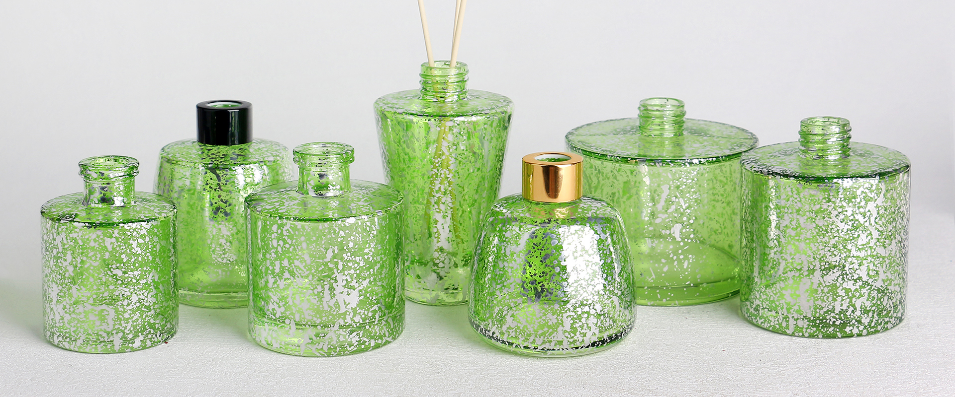 Electroplated laser glass diffuser bottles banner