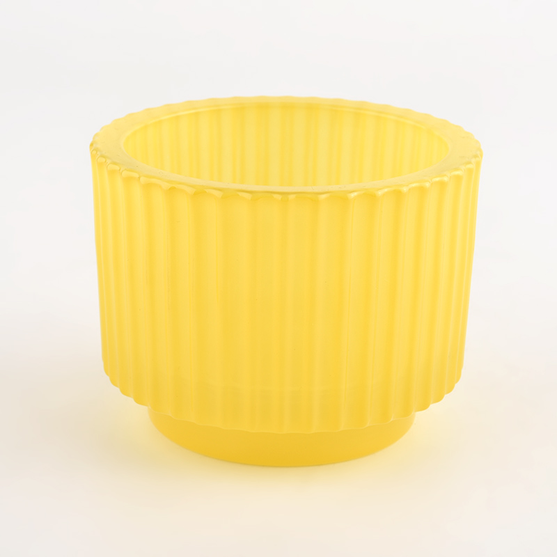 yellow glass candle holder with vertical line