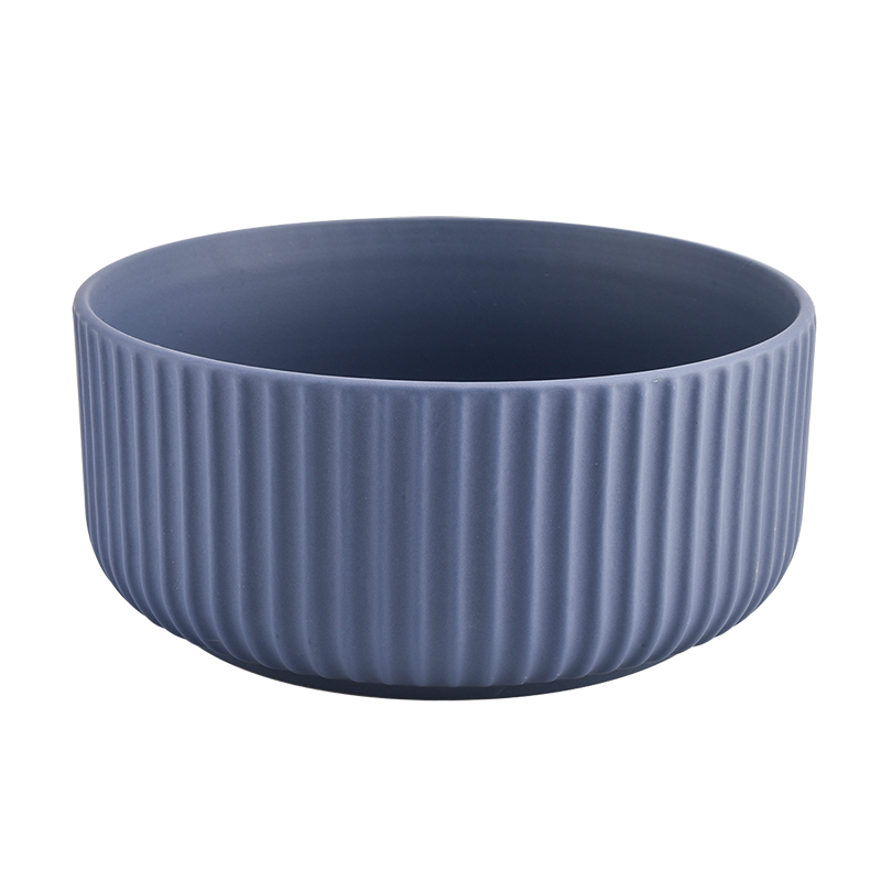 large blue ceramic container with embossed stripes