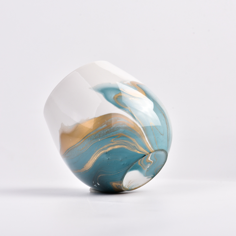 marble color on the ceramic candle jar by hand painting processing