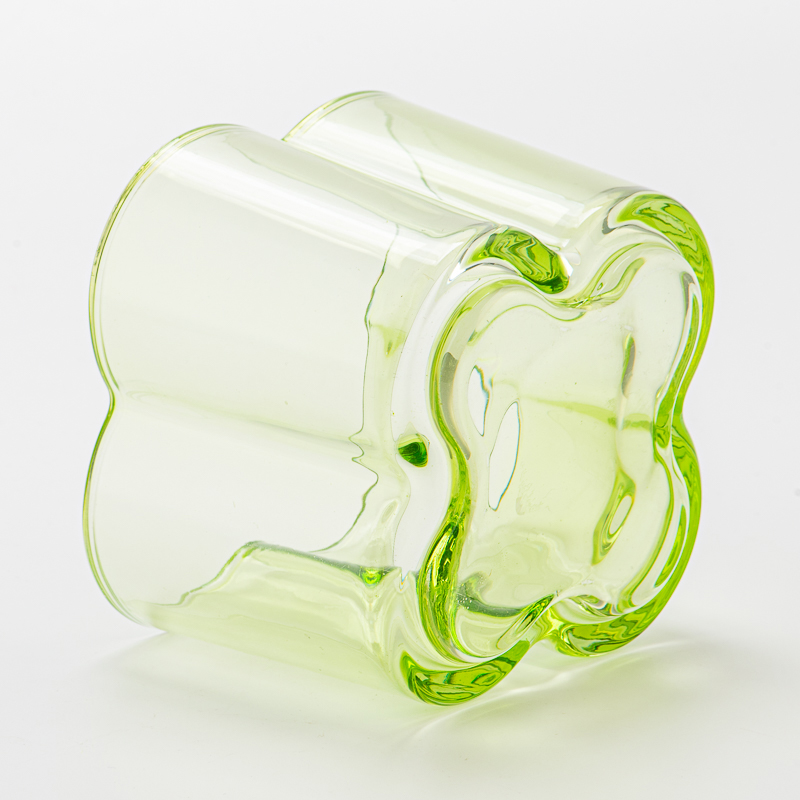 Popular green color glass candle vessel with flower design