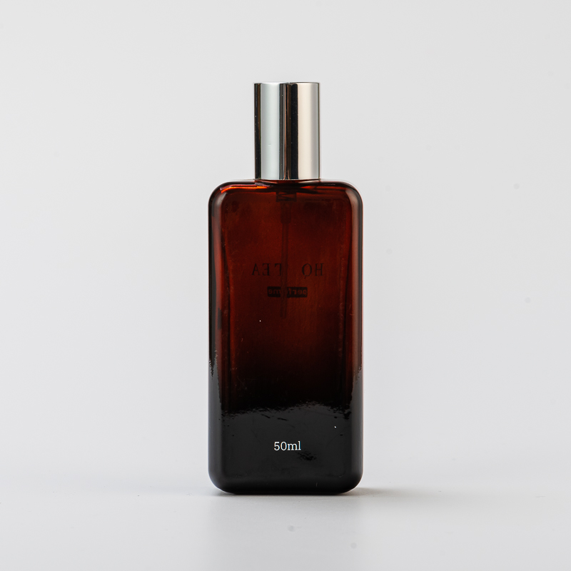 卸売50mlアンバーガラス香水ボトル付きキャップ