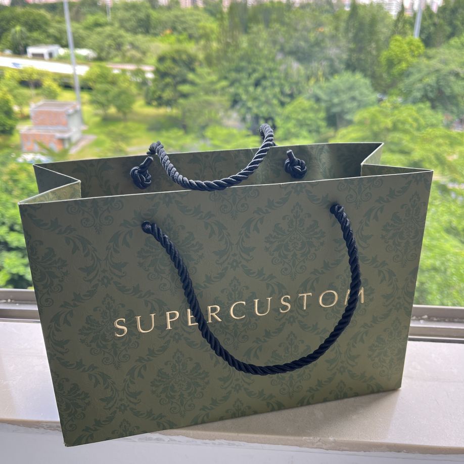 Green paper bag with specific embossed texture