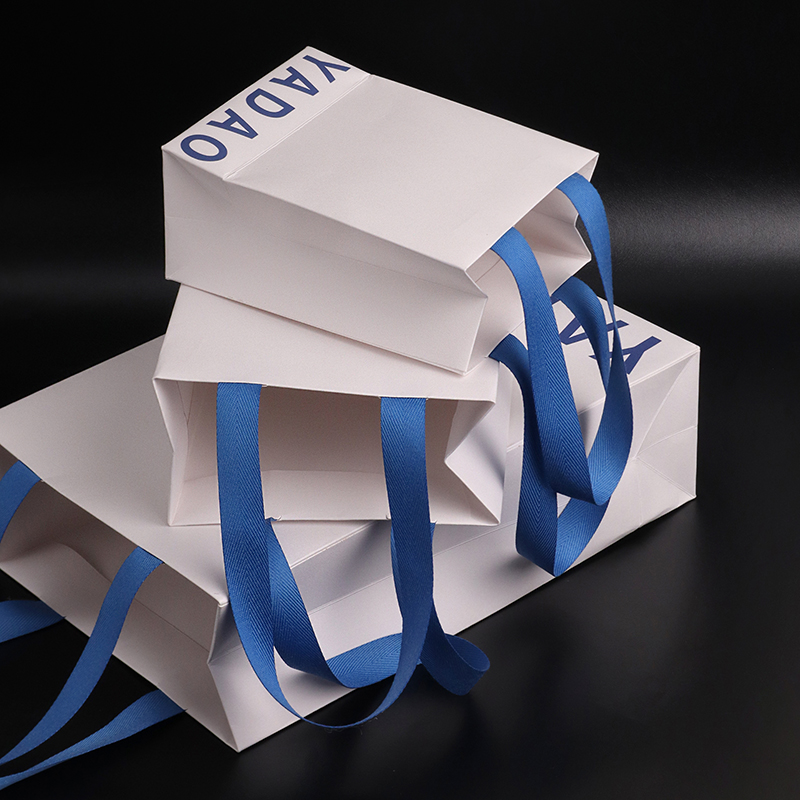 Elevate Your Brand with Custom White Paper Bags & Blue Cotton Handles