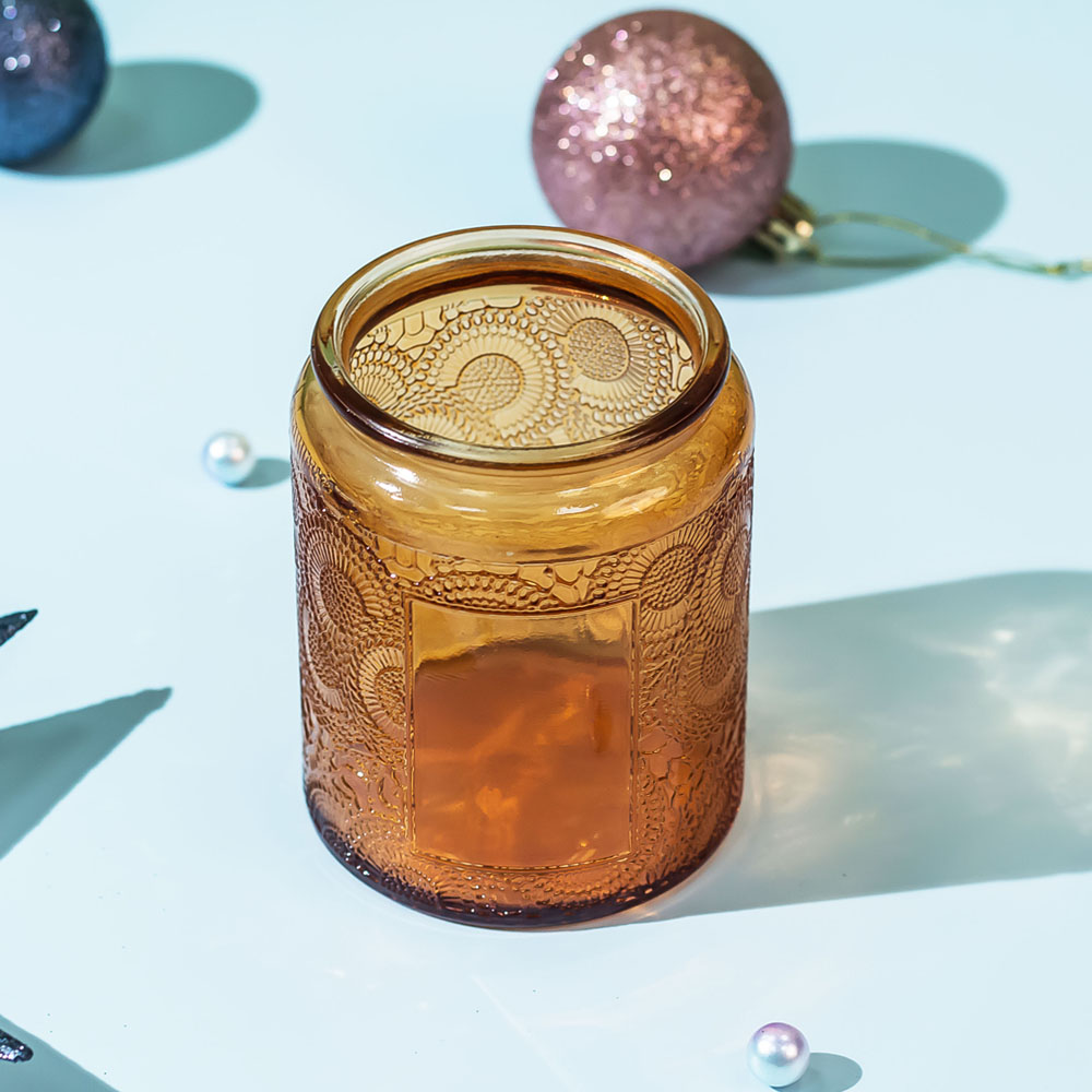 Frasco de vela âmbar Boticário com tampa de lata para velas perfumadas