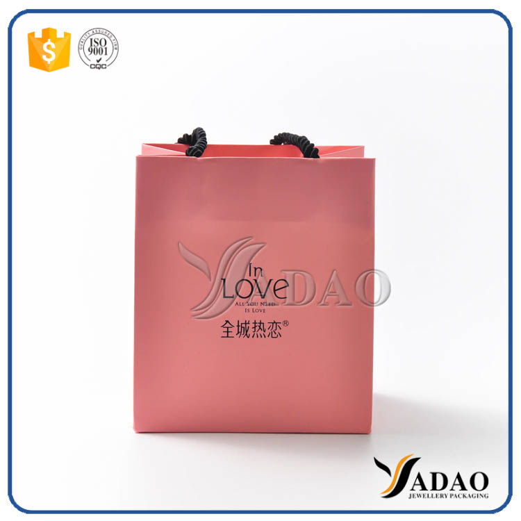 Wholesale new design pink paper gift bag shopping craft handbag with free logo customize
