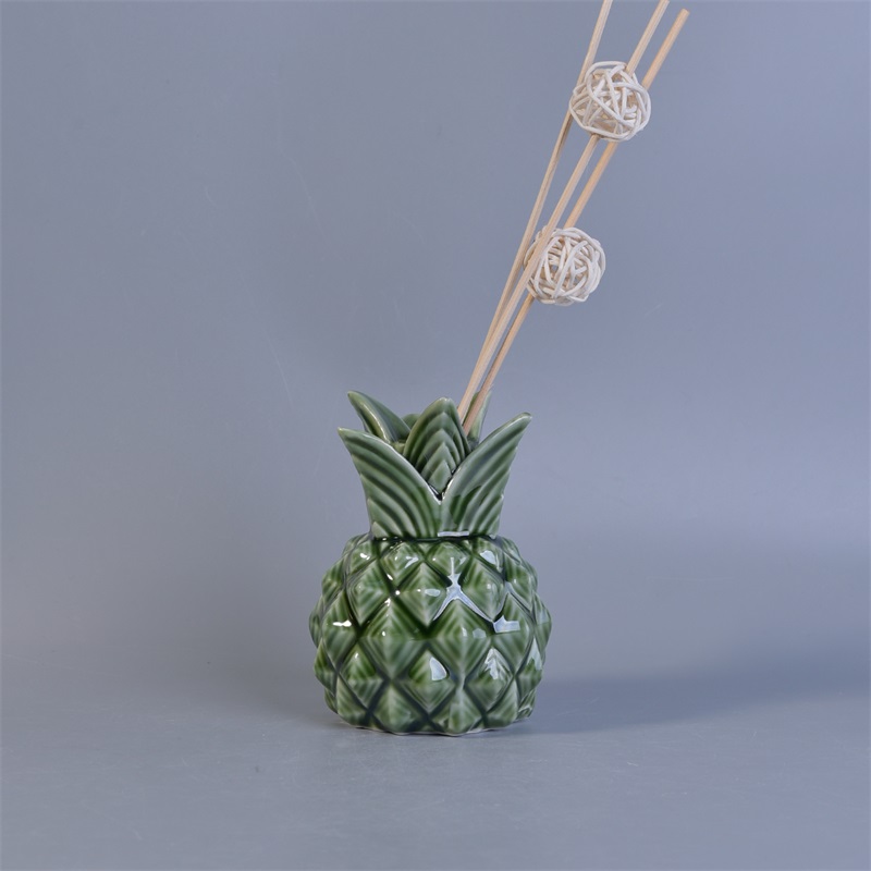 Green pineapple shaped ceramic diffuser bottles with reed