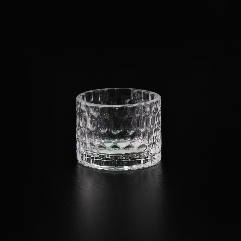 Glass candle holder with emboss pattern