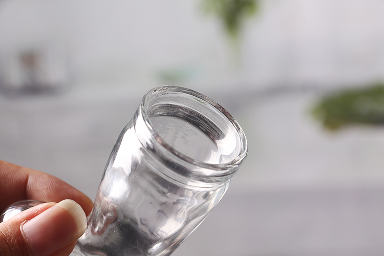 Boot shaped glass bottle