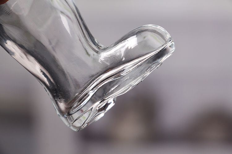Boot shaped glass bottle