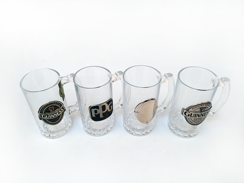 beer glass with metal logo