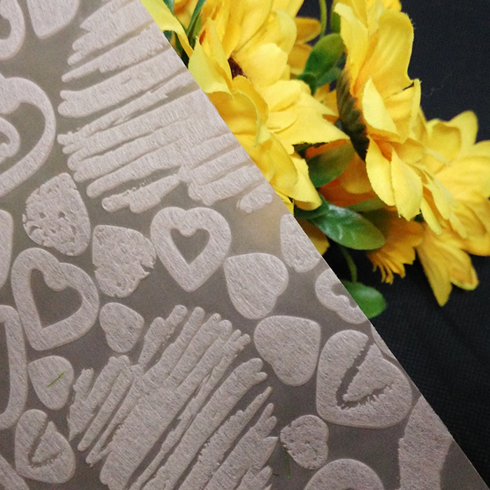 O tecido do papel de envolvimento, empacota não tecido da flor em vendas, envoltórios florais